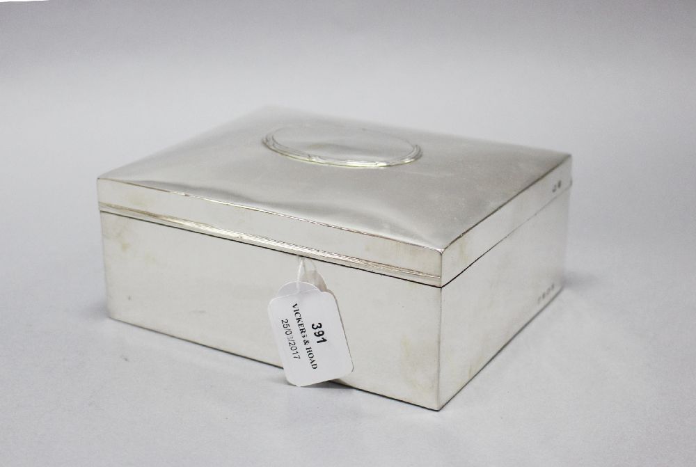 A large antique sterling silver box, with raised clean cartouche and bordered reed & ribbon