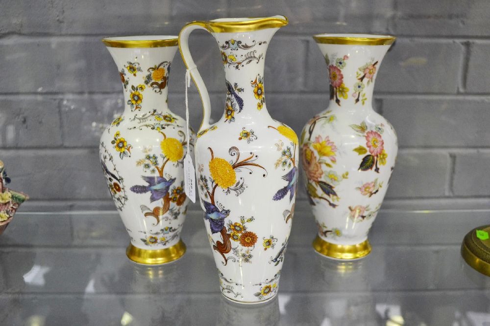 Two KPM vases and jug decorated along with flowers & birds, approx 26cm H and smaller (3)