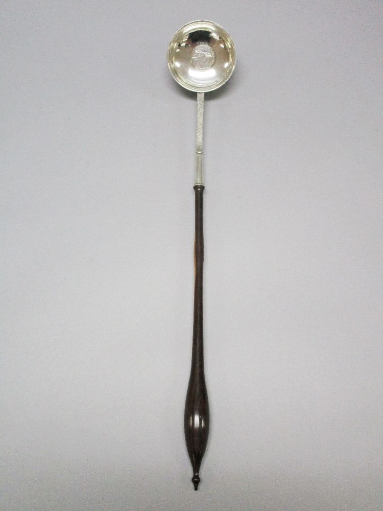Georgian punch ladle with a sterling silver stem and bowl set with a coin inset bowl and a lignum