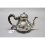 Important & rare Queen Anne Britannia silver teapot, with a hinged lid, collet foot and in a pear