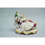 Dresden porcelain figure group of a man and woman courting on settee