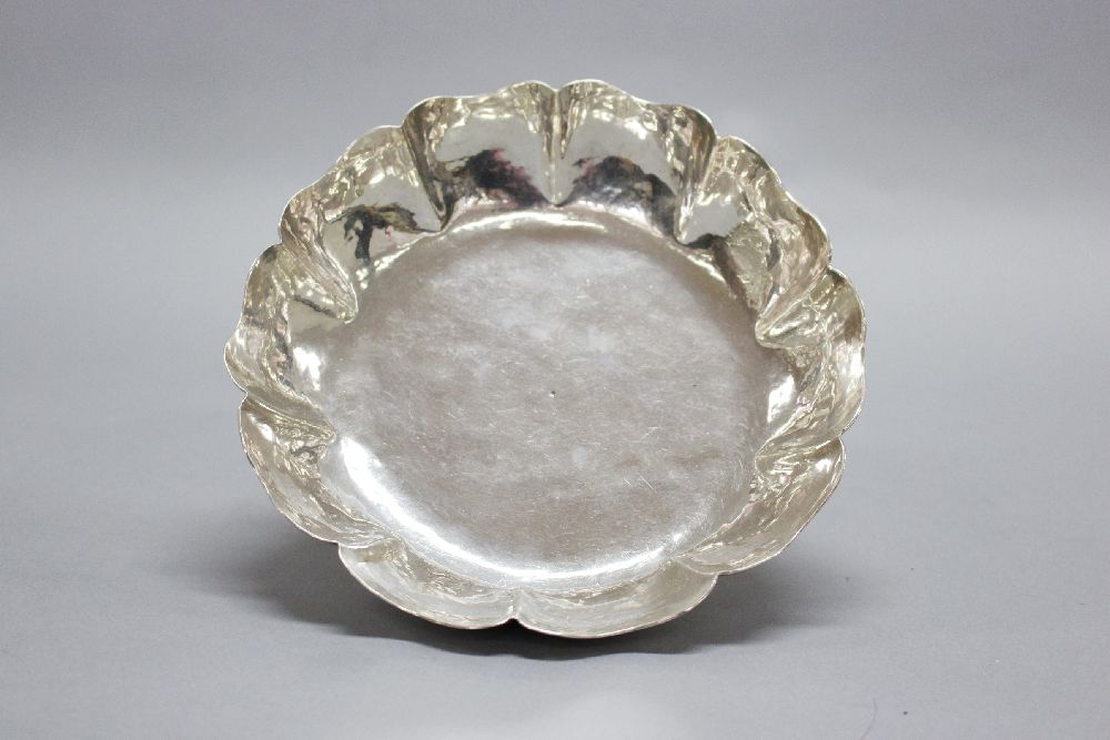 George I sterling silver dish, of scalloped fluted form and hammered body with a short collet foot