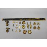 A fine group of Australian military badges and helmet fittings. Approximately 15 items.