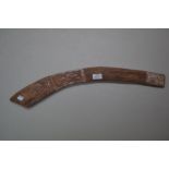 Aboriginal carved hardwood boomerang painted in natural earth pigments, 65 cm long