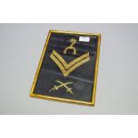 Framed insignia, Cadet Corporal H.L Westmorland Winnipeg, Canada 1934, with photos to verso &