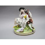 Continental Porcelain figure group of a gentlemen courting a young girl, makers mark to back, approx