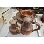 Antique French copper food warmer along with two antique copper lidded jugs and a wooden handled