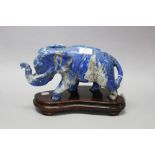 Carved Blue stone elephant on stand, approx 21cm H including stand x 33cm W