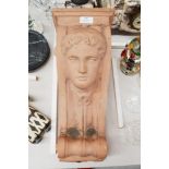 Terracotta term / wall bracket with mans face to front, approx 44cm H x 19cm W x 28cm D