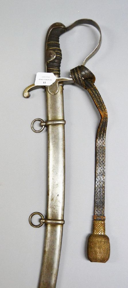 A choice antique Imperial German cavalry officers sword with scabbard by I.M. Esser of Cologne. (
