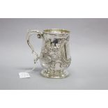 A large George III sterling silver tankard, of baulster form, cast scroll handle, acanthus leaf