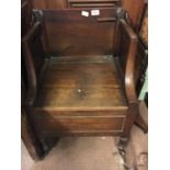 Unusual Georgian mahogany chair with brass casters.