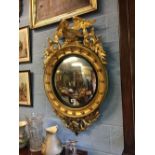 Good quality 19th C. gilt wood convex mirror summounted with an eagle.