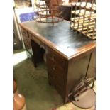 Late Edwardian mahogany knee hole desk with tooled leather top.