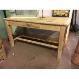 Pine kitchen table with single drawer in the frieze and raised on square legs and double