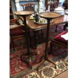 Pair of Victorian mahogany torcheres on tripod base.