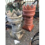 Two castle top chimney pots.