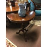 Edwardian mahogany D end side table on tripod base.