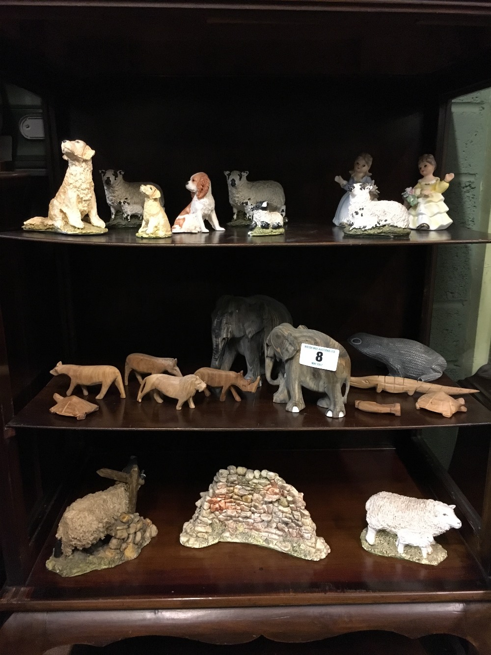 Three shelves - Misc. lot of carved wooden animals and ceramic animals.