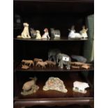 Three shelves - Misc. lot of carved wooden animals and ceramic animals.