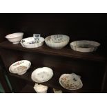 Two shelves of ceramics including Aynsley and Wedgewood. (7 pieces).