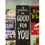 GUINNESS IS GOOD FOR YOU advertisement painted on board.