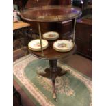 An exceptional quality Georgian mahogany dumb waiter on turned brass support tri-pod base and