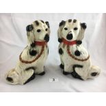 Pair of ceramic dogs in the Staffordshire style.