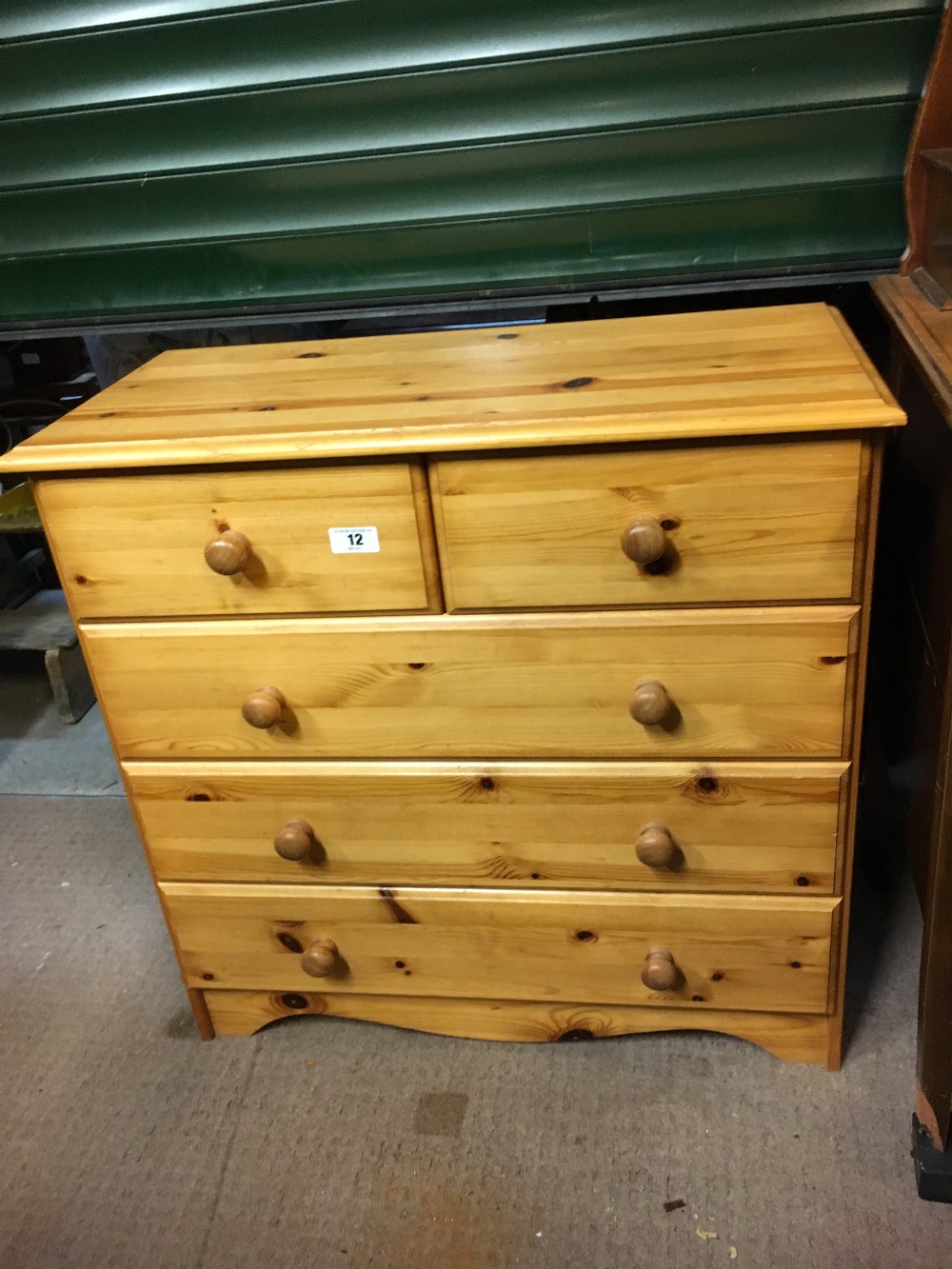 Modern pine chest of drawers the two short drawers over three long drawers.