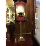 19th C. brass corinthium coloumned lamp with original ruby glass bowl and etched shade.