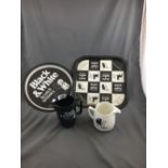 Two BLACK AND WHITE advertising trays and two jugs.