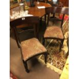 Set of three Georgian mahogany dining chairs on reeded legs.