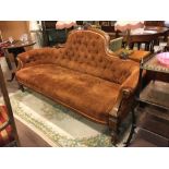 Victorian inlaid walnut sofa on turned legs.