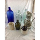 Collection of six miscellaneous chemist's bottles including large blue glass bottle.