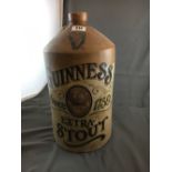 GUINNESS EXTRA STOUT stoneware flagon and another stoneware flagon.