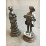 Two bronzed figures of a gentleman and a lady.