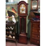 Mahogany long cased clock with Westminster chimes.