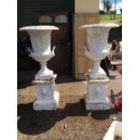 Large pair of decorative cast iron urns.