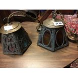 Two brass Art Nouveau hanging light shades with coloured glass.