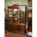 William IV mahogany libray book case with three glazed doors over three panelled doors. (259 cm H