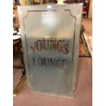 Etched Young's Lounge glass panel.