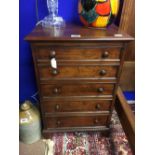 Georgian mahogany pot cupboard in the form of a chest of draws.