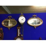 Pair of exceptional quality oval gilt mirror in the Adams style.