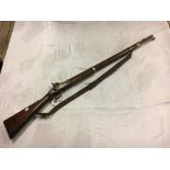 19th. C. percussion capped musket with original leather strap.