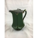 Green ceramic jug with pewter lid.