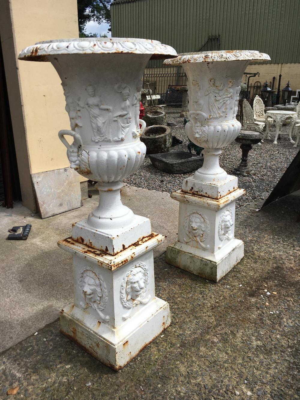 Large pair of decorative cast iron urns.