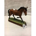 Border Fine Arts model of a horse mounted on a wooden plinth.