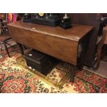 Georgian mahogany drop leaf table with square legs.