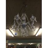 Five branch glass and metal chandelier.