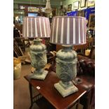 Pair of decorative lamp bases decorated with acanthus leaves.